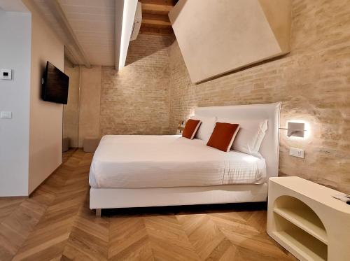 Letto o letti in una camera di Palazzo Cortesi