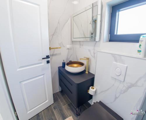a bathroom with a sink and a mirror at Bunska Venera in Blagaj