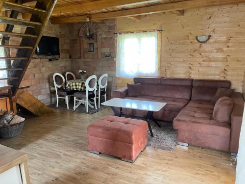a living room with a couch and a table at Brvnare Sekulic in Sekulić 