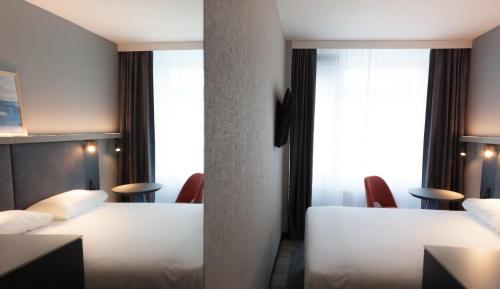 Ένα ή περισσότερα κρεβάτια σε δωμάτιο στο ibis Styles Den Haag Scheveningen