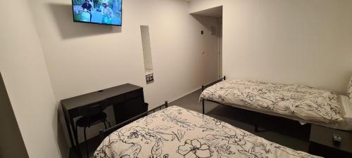 Ένα ή περισσότερα κρεβάτια σε δωμάτιο στο Hostal NANA B&B