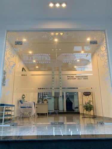 a view of a building with a table and chairs at Timothy House Hue in Hue