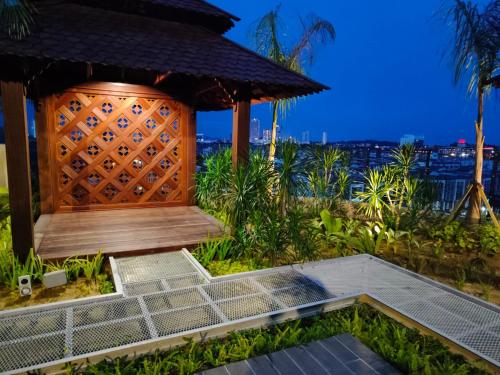 a gazebo at a resort with the ocean in the background at Bali Melaka SeaView WaterPark 2-5Pax 5minJonker Projector in Melaka