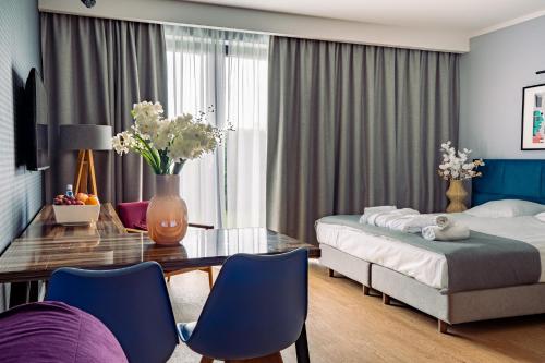 Postel nebo postele na pokoji v ubytování Mielenko & Spa ex Baltin Hotel