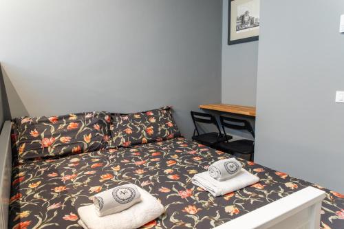 Postel nebo postele na pokoji v ubytování New Design Studio - Prada & Duomo a pochi minuti