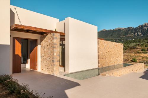 a house with a view of the mountains at Noema Luxury Retreat Villas - Adults only in Kos Town