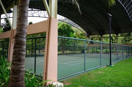 a tennis court in a building with a tennis court at Sunset Room at Pico - Hamilo Coast Pico De Loro in Nasugbu