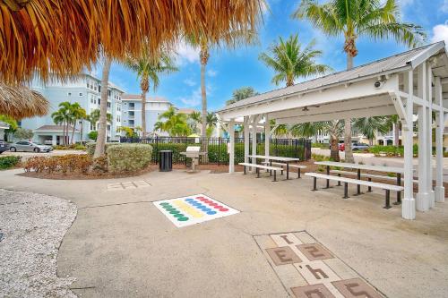 a picnic shelter with benches and palm trees at Last Mango in Bradenton