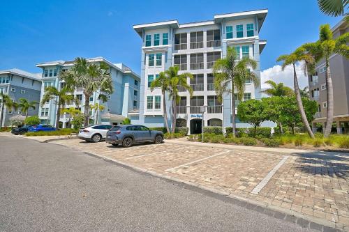 a large building with cars parked in a parking lot at Last Mango in Bradenton