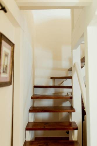 a staircase in a house with wooden steps at El Molino de Bonaco in San Vicente de la Barquera