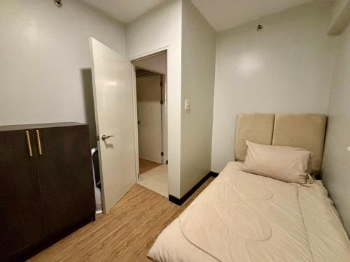 Ένα ή περισσότερα κρεβάτια σε δωμάτιο στο Verdon Parc Condominium