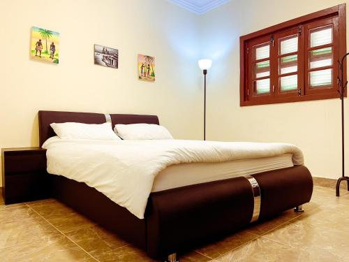 Postel nebo postele na pokoji v ubytování Tchada- Duplex