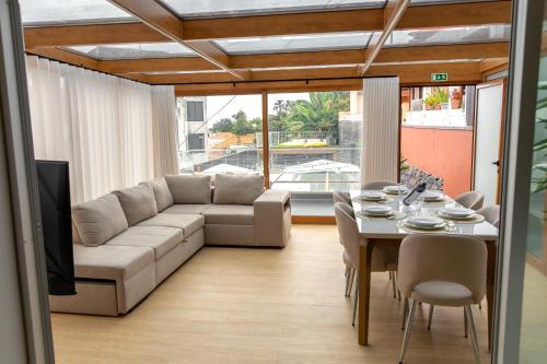 a living room with a couch and a table at HOMELIKE FUNCHAL II in Funchal