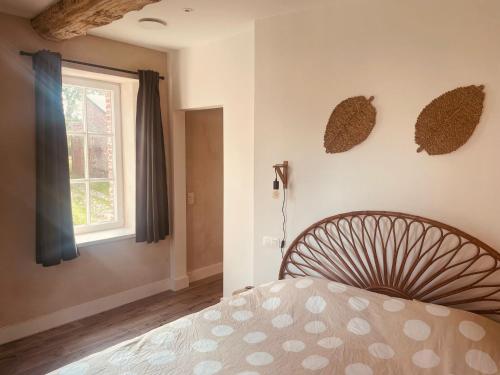Postel nebo postele na pokoji v ubytování Gîte du château de Baudemont