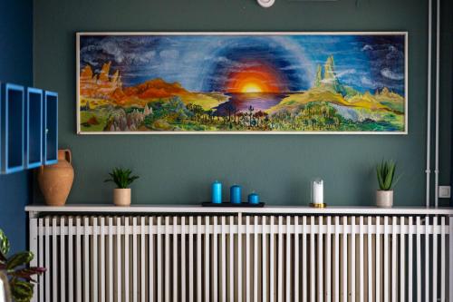 a living room with a painting on the wall at Easy Stay by Hotel La Perla in Ascona