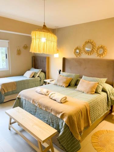 a bedroom with a large bed and a couch at Giova Apart Salta in Salta