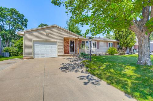 a house with a garage and a tree at Walk to Park Waterloo Home with Furnished Deck in Waterloo
