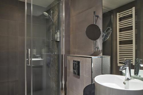 a bathroom with a shower and a sink and a shower at Timhotel Tour Montparnasse in Paris
