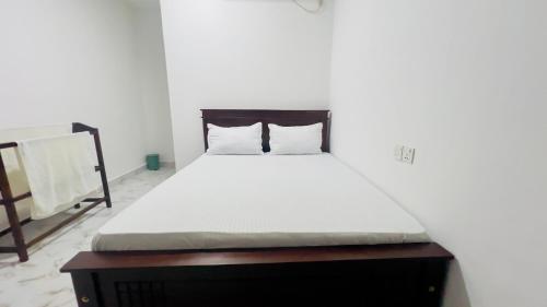Cama o camas de una habitación en Coconut Leaf Shadow Guest