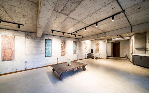 a large room with a table in the middle of it at Kikonia Art & Suites in Akyaka