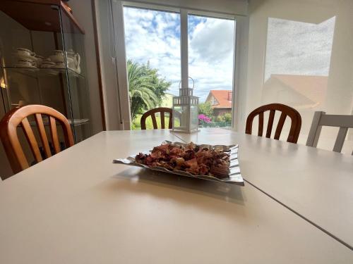 a plate of food sitting on top of a table at Cerca de Santander La Llosa de Muriedas en Urbanización in Camargo
