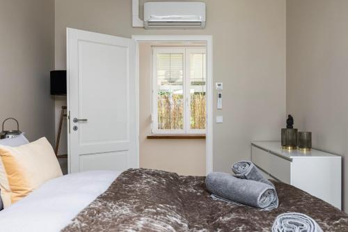 a bedroom with a bed with two pillows on it at Villa von Maximus in Leipzig