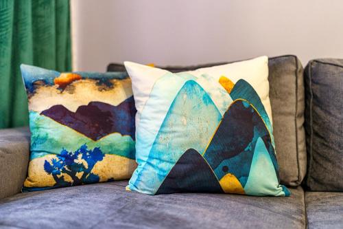 two pillows sitting on top of a couch at Mursala Pamporovo in Pamporovo