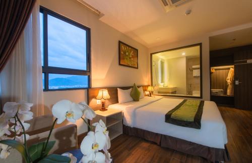 Postel nebo postele na pokoji v ubytování BN Boutique Nha Trang Beach