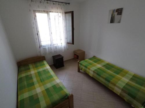 Postel nebo postele na pokoji v ubytování Apartman Jelena