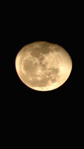 aizonspectral view of a yellow moon in the sky at Paje Blu Boutique Hotel in Paje