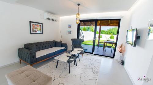 a living room with a couch and a table at Bunska Venera in Blagaj