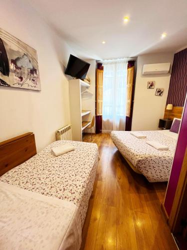 Ένα ή περισσότερα κρεβάτια σε δωμάτιο στο Hostal Abel Victoriano
