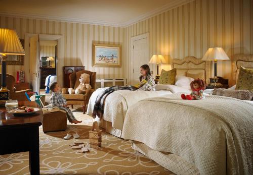 a woman and two children sitting in a hotel room at Hayfield Manor in Cork