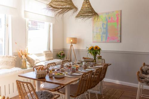 a dining room with a table with food on it at Inselpension Henriette in Norderney