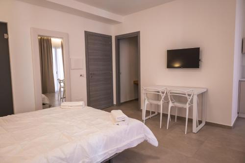Ένα ή περισσότερα κρεβάτια σε δωμάτιο στο Aura Room