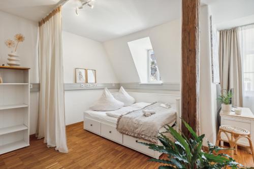Ένα ή περισσότερα κρεβάτια σε δωμάτιο στο Loft über den Dächern Coburgs, Parkplatz