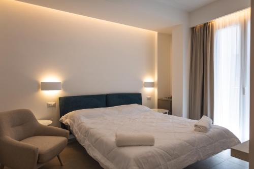Ένα ή περισσότερα κρεβάτια σε δωμάτιο στο Aura Room