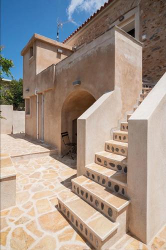 a set of stairs on the side of a building at Neapolis Oasis -- Upper House in Neapoli Voion