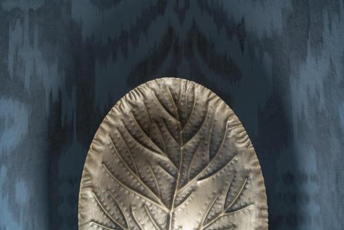 a metal plate with a tree etched into it at San Clemente House in Seville