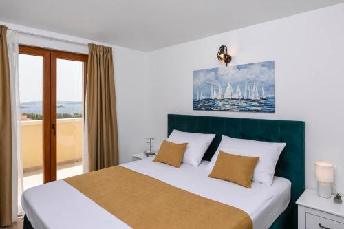 Postel nebo postele na pokoji v ubytování Holiday Villa Perla