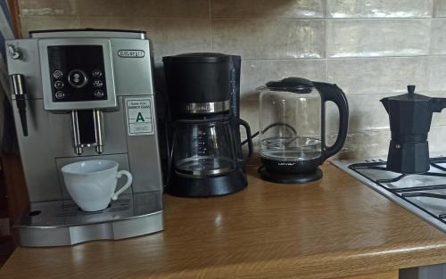 a coffeemaker and a coffee maker on a counter at Panka House in Zalakaros
