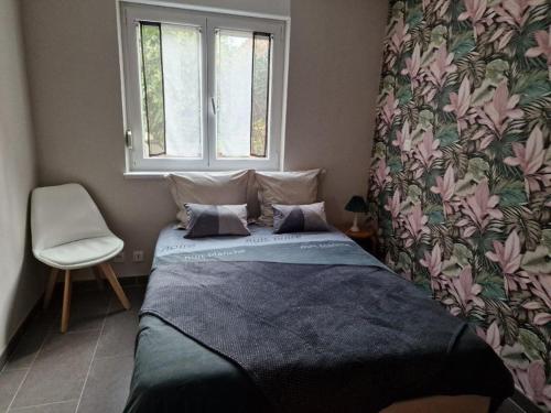 Tempat tidur dalam kamar di Gîte Alsace en vue