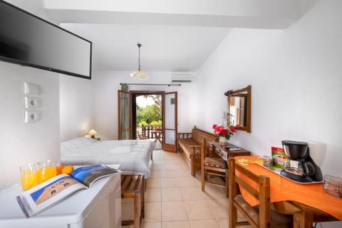 a living room with a kitchen and a living room at Vergonis Studios in Koropi