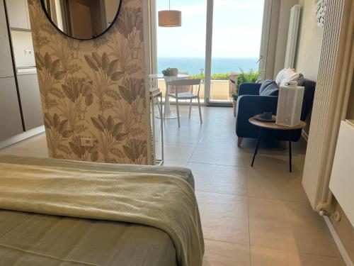 a bedroom with a view of a living room at IL MARE BLU in Lerici