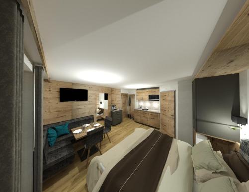 a bedroom with a large bed and a desk in it at Ferien Bauernhof Maurachhof in Sankt Johann im Pongau