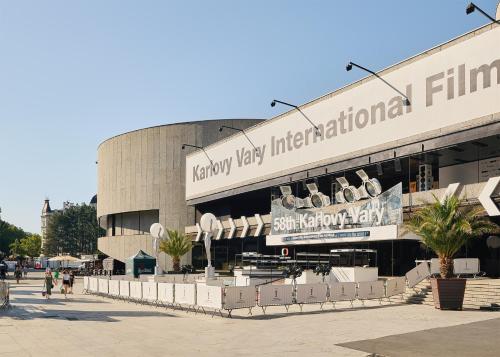 a building with a sign for the lauryy key international terminal at IMPERIAL Apartments in Karlovy Vary