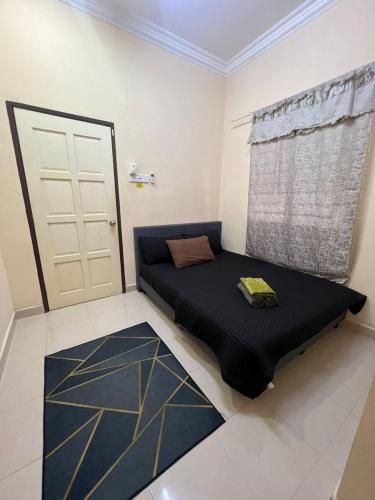 Ένα ή περισσότερα κρεβάτια σε δωμάτιο στο Homestay Langkawi Guesthouse 3 bedrooms