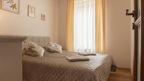 Postel nebo postele na pokoji v ubytování Thermal Írisz Apartman