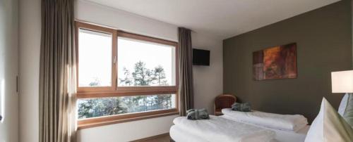 Ένα ή περισσότερα κρεβάτια σε δωμάτιο στο Served Apartements Belvedere