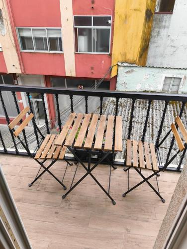 a table and chairs sitting on top of a balcony at Villa Galicia (Padrón) in Padrón